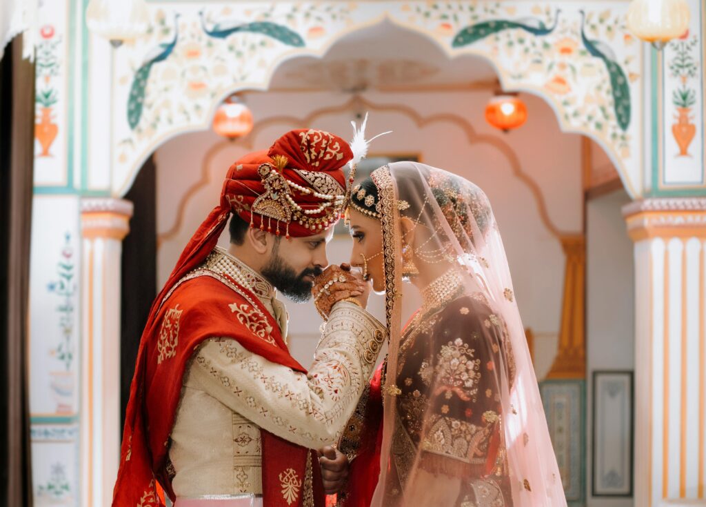 Romantic Indian wedding couple in traditional attire during ceremony in Jaipur.